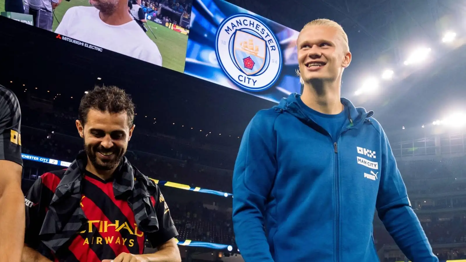 Bernardo Silva and Erling Haaland of Man City