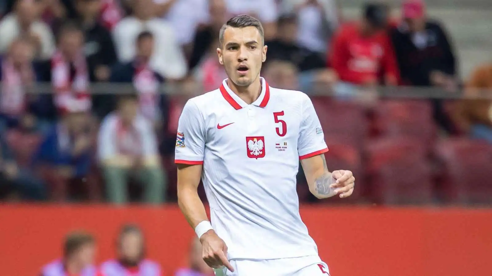 Jakub Kiwior playing for Poland