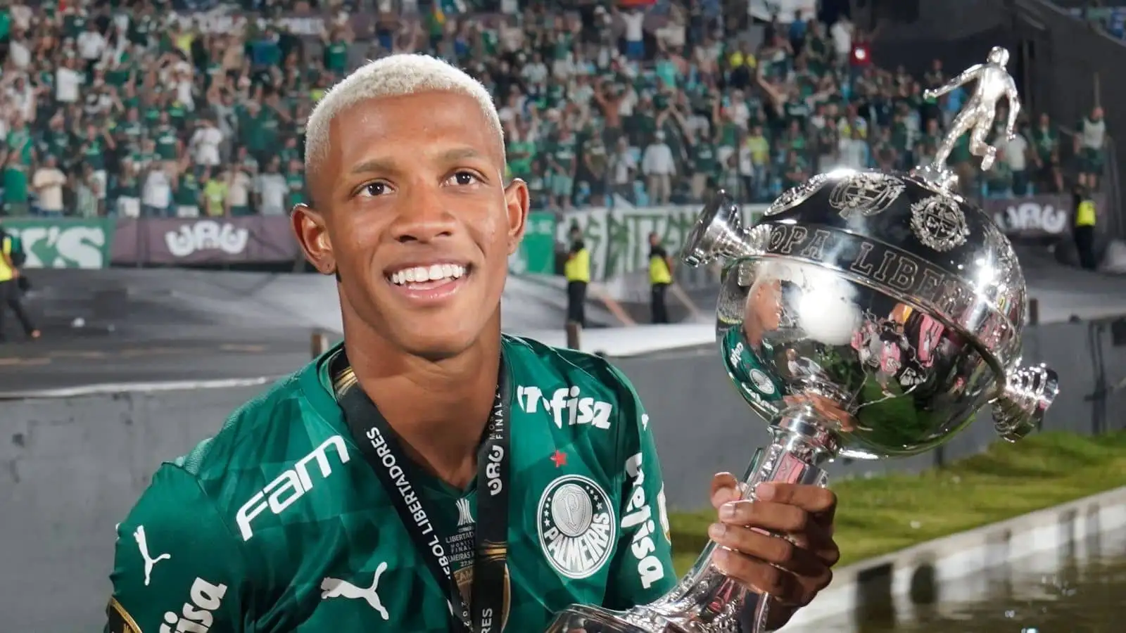 Danilo celebrates winning the Copa Libertadores with the trophy after Palmeira beat Flamengo at Estadio Centenario, Montevideo, Uruguay