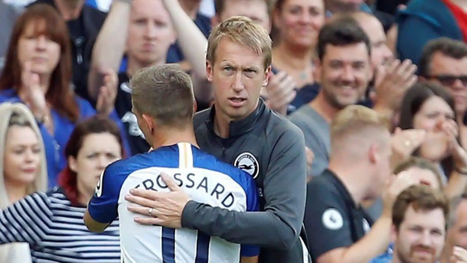 Leandro Trossard hugs Brighton and Hove Albion manager Graham Potter as he is substituted off during Premier League game v West Ham