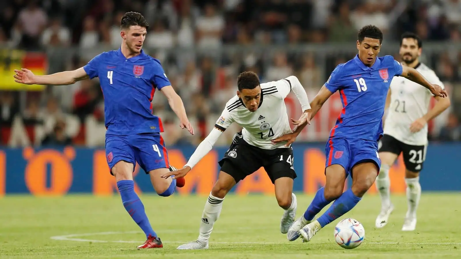 Jude Bellingham on the ball and watched by Declan Rice and Jamal Musiala during UEFA Nations League group stage for final tournament Group A3 between Germany 1-1 England at the Allianz Arena in Munich