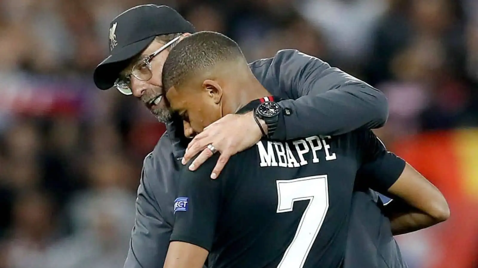 Kylian Mbappe hugs Jurgen Klopp after Liverpool beat PSG in Champions League game at Anfield