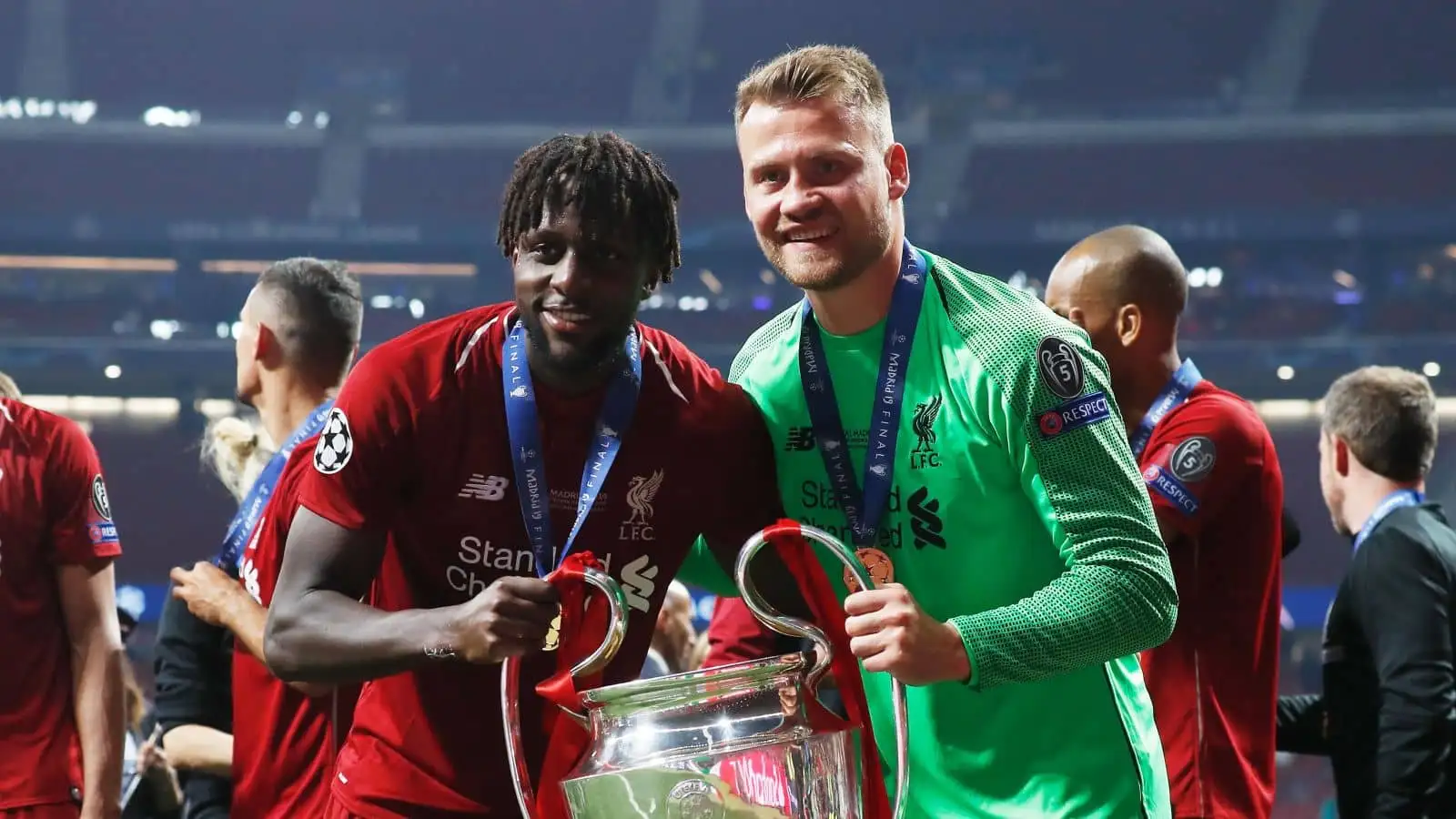 Simon Mignolet and Divock Origi celebrate after Liverpool win the Champions League final, beating Tottenham 2-0 at Wanda Metropolitano, Madrid