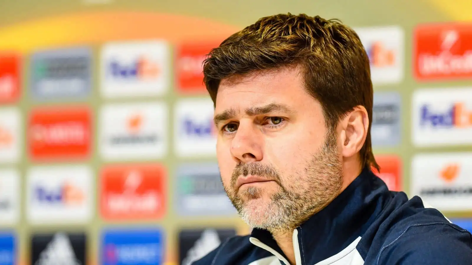 Mauricio Pochettino attends a press conference during his time in charge at Tottenham