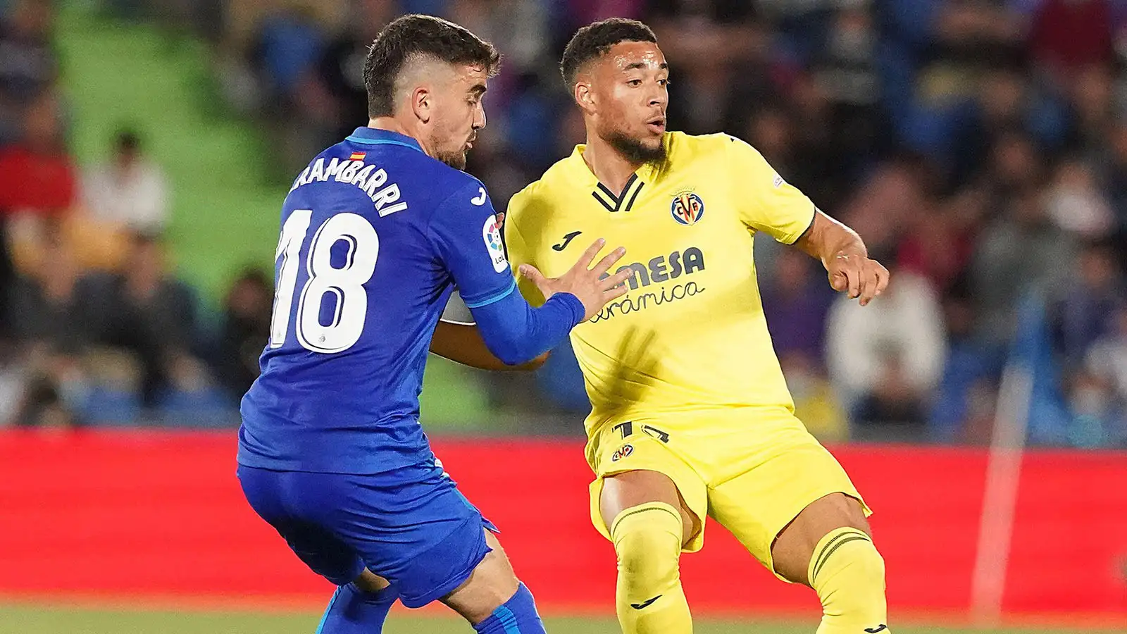 Getafe CF's Mauro Arambarri (l) and Villarreal CF's Arnaut Danjuma