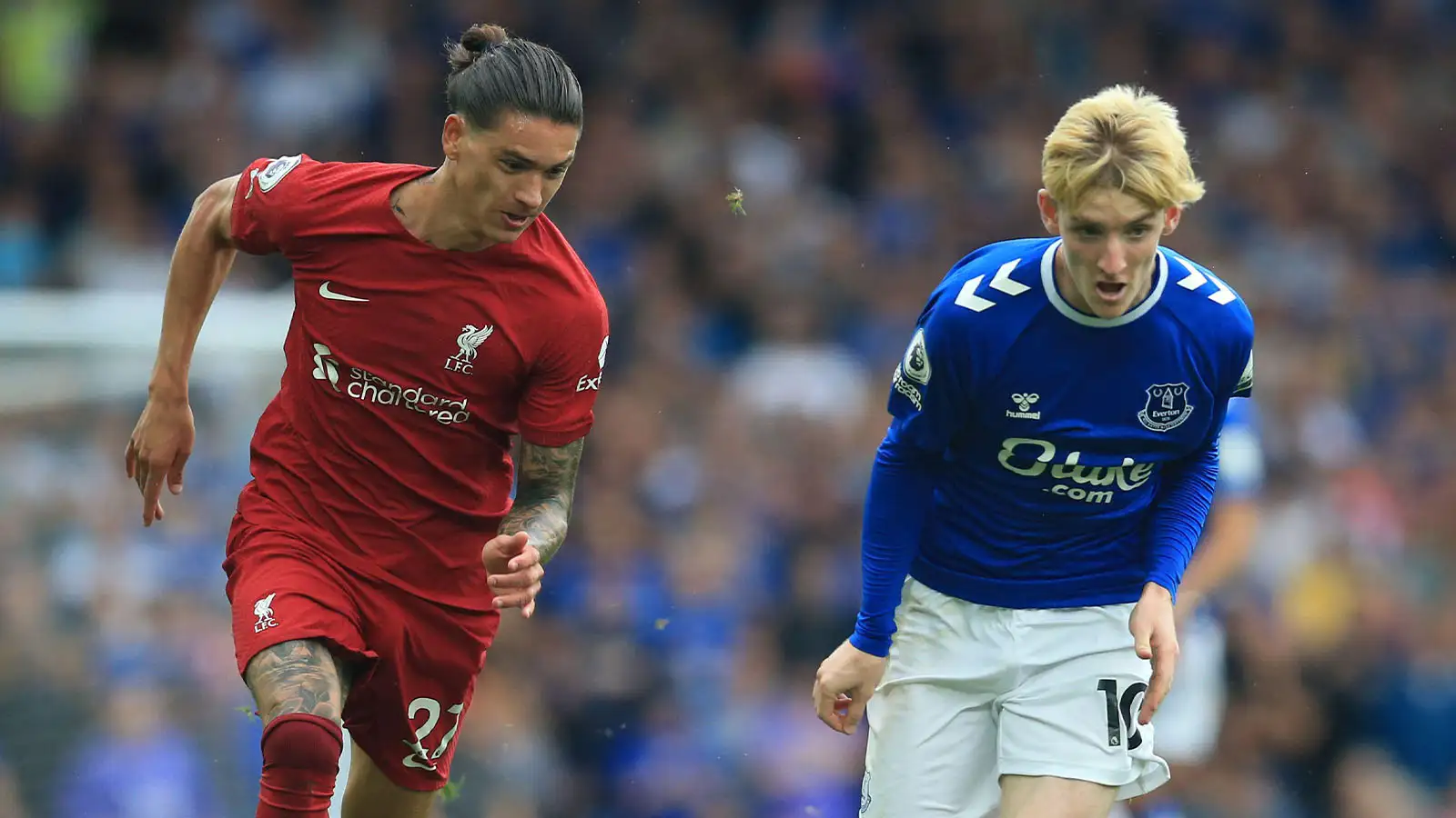 Anthony Gordon of Everton takes on Darwin Nunez of Liverpool