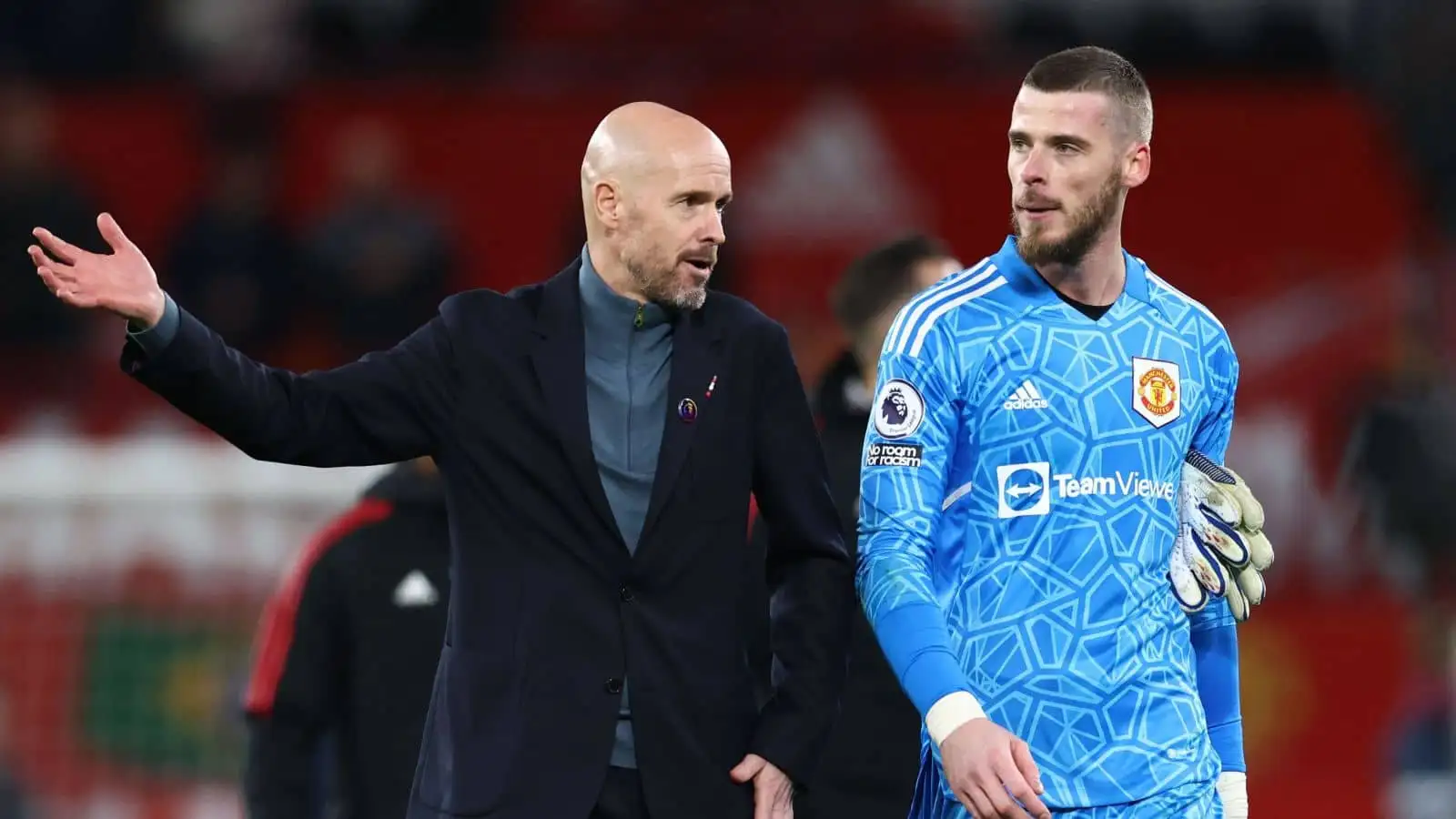 Erik ten Hag manager of Manchester United walks off with David De Gea of Manchester United during the Premier League match at Old Trafford