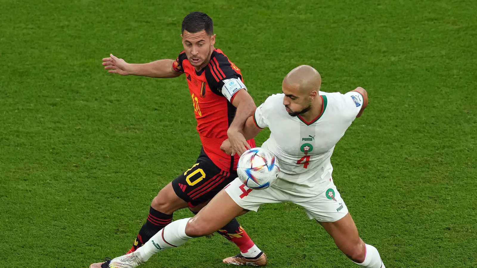 Belgium's Eden Hazard (left) and Morocco's Sofyan Amrabat (right) battle for the ball during the FIFA World Cup