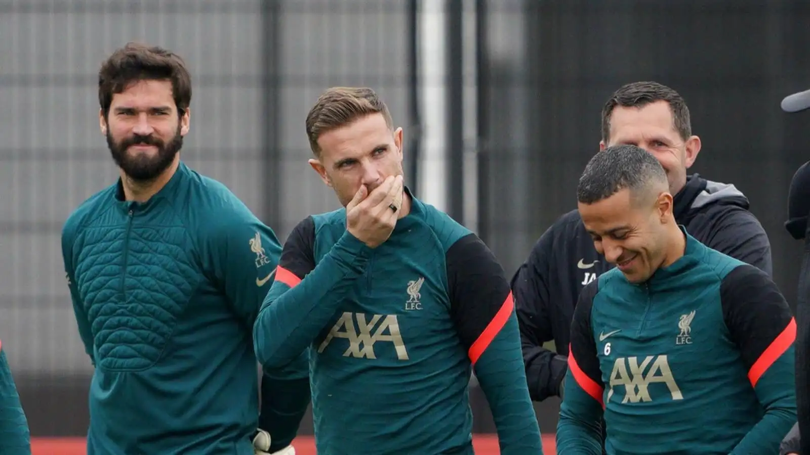 Alisson, Jordan Henderson and Thiago Alcantara of Liverpool