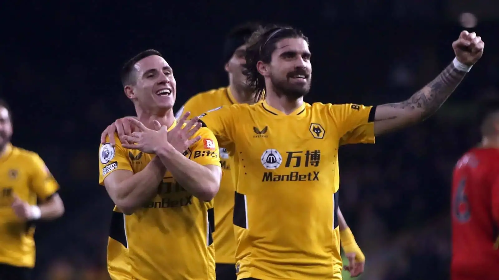 Wolverhampton Wanderers' Daniel Podence (left) celebrates with Ruben Neves after scoring their side's third goal of the game during the Premier League match at Molineux Stadium, Wolverhampton