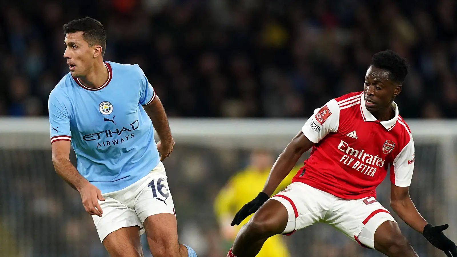 Manchester City's Rodri (left) and Arsenal's Albert Sambi Lokonga battle for the ball during the Emirates FA Cup fourth round match at Etihad Stadium, Manchester. Picture date: Friday January 27, 2023.