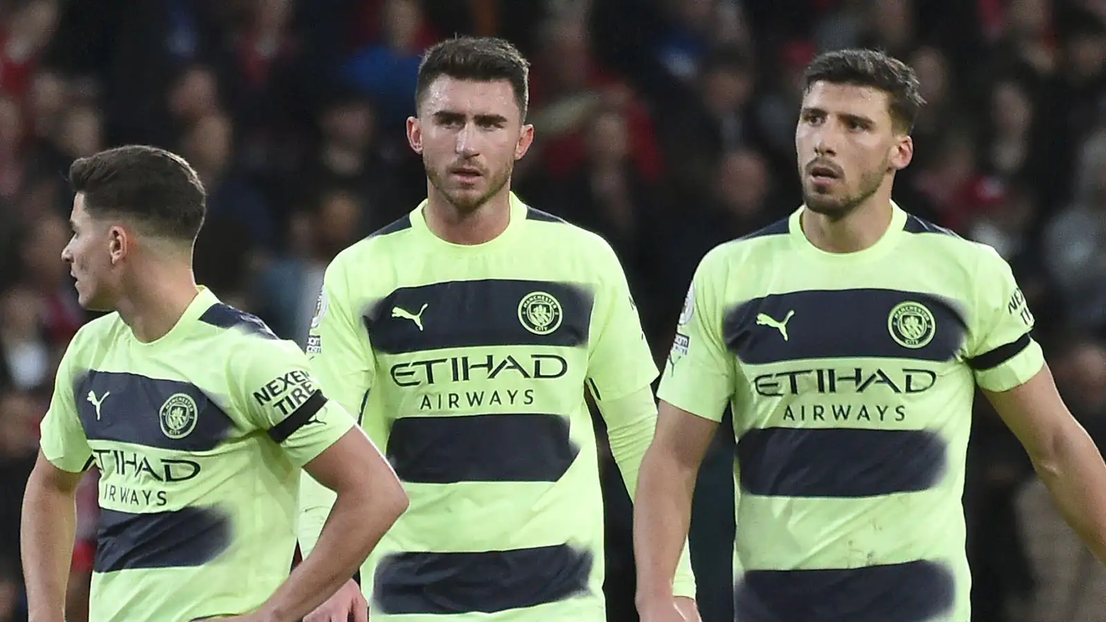 Manchester City's Julian Alvarez, left, Manchester City's Aymeric Laporte, centre, Manchester City's Ruben Dias walk on the pitch at the end of the English Premier League soccer match between Nottingham Forest and Manchester City at City ground in Nottingham