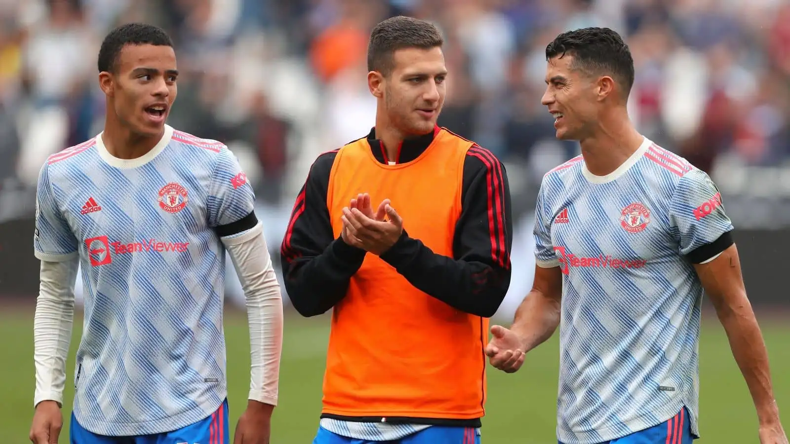 Cristiano Ronaldo of Manchester United is seen with Mason Greenwood (L) and Diogo Dalot (R) - West Ham United v Manchester United, Premier League, London Stadium, London