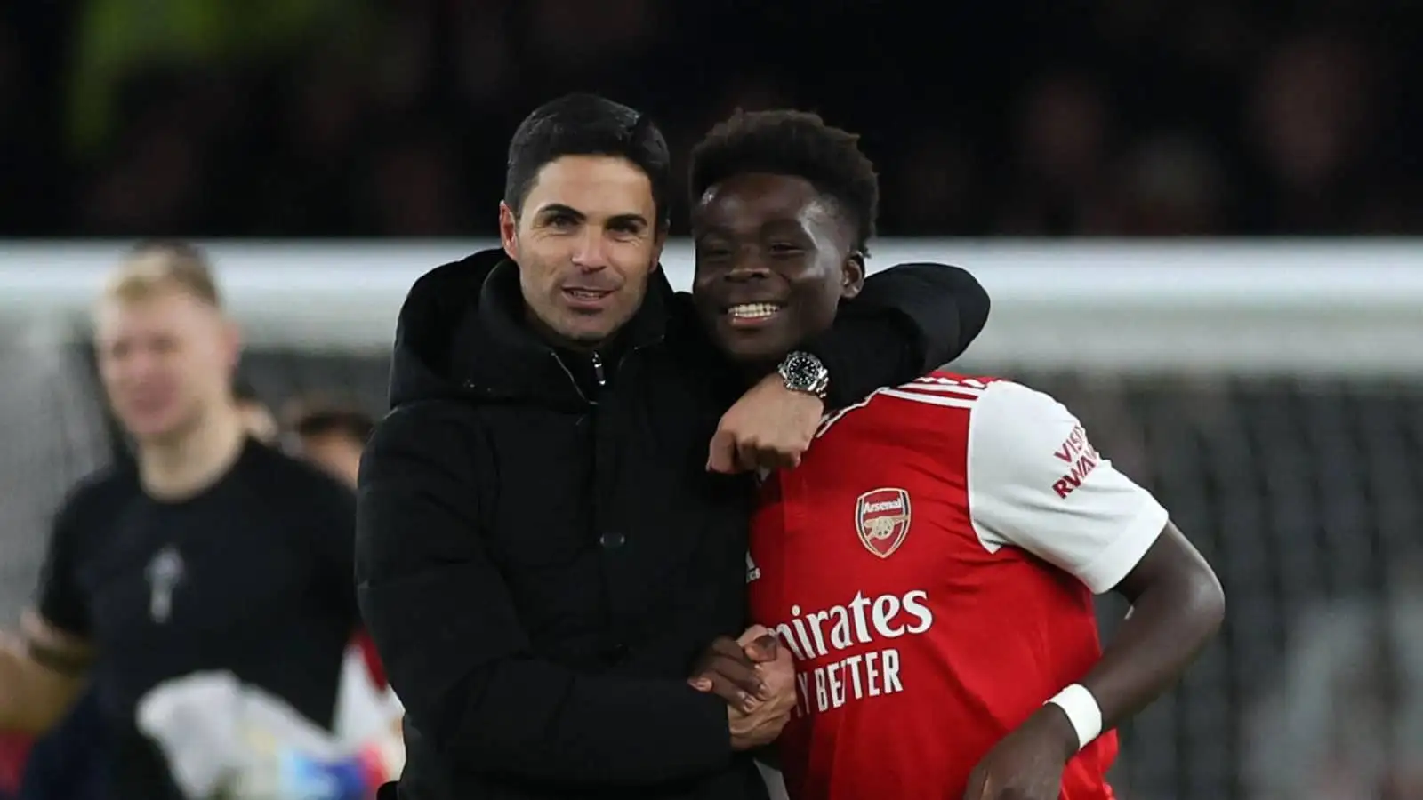 Mikel Arteta and Bukayo Saka of Arsenal