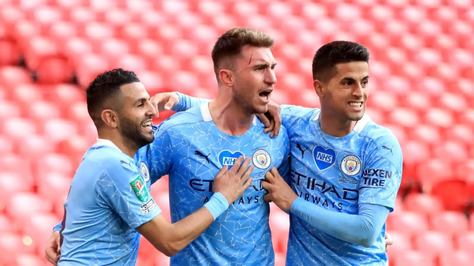 Riyad Mahrez, Aymeric Laporte and Joao Cancelo of Man City