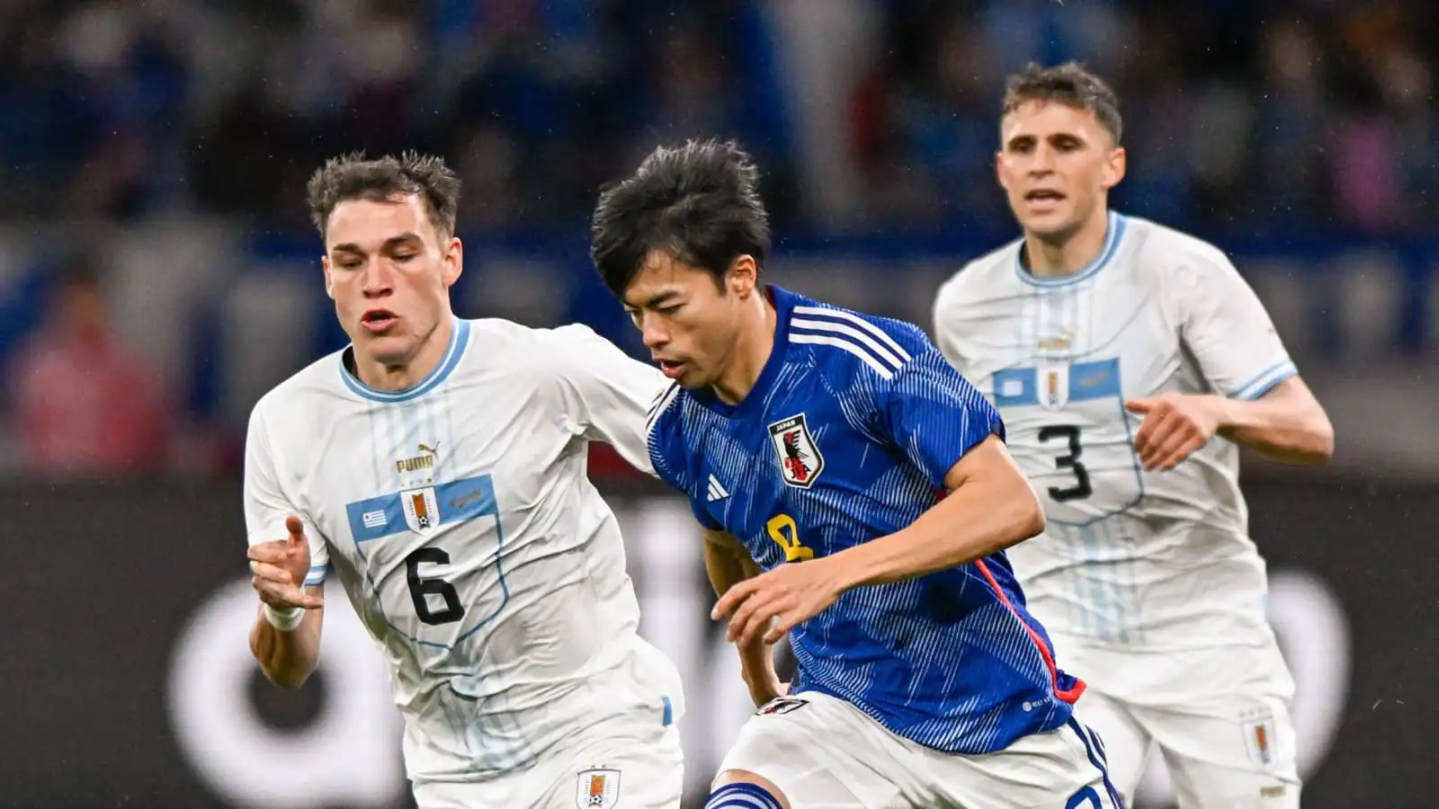 Uruguay midfielder Manuel Ugarte and Japan winger Kaoru Mitoma