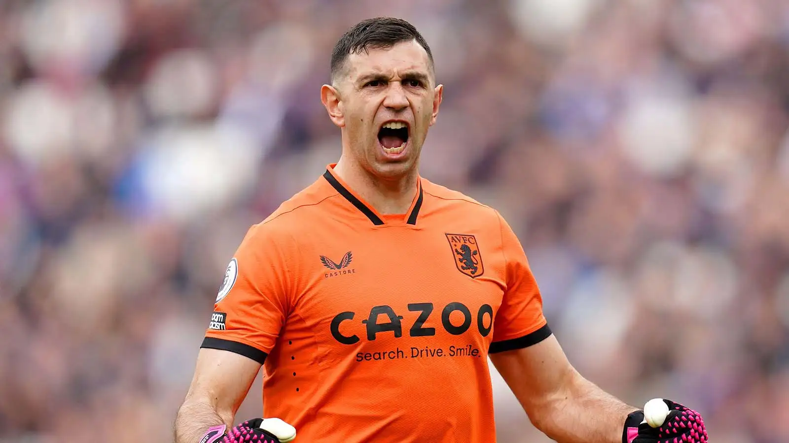 Aston Villa goalkeeper Emiliano Martinez celebrates after team-mate Ollie Watkins (not pictured) scores their side's first goal of the game during the Premier League match at the London Stadium, London