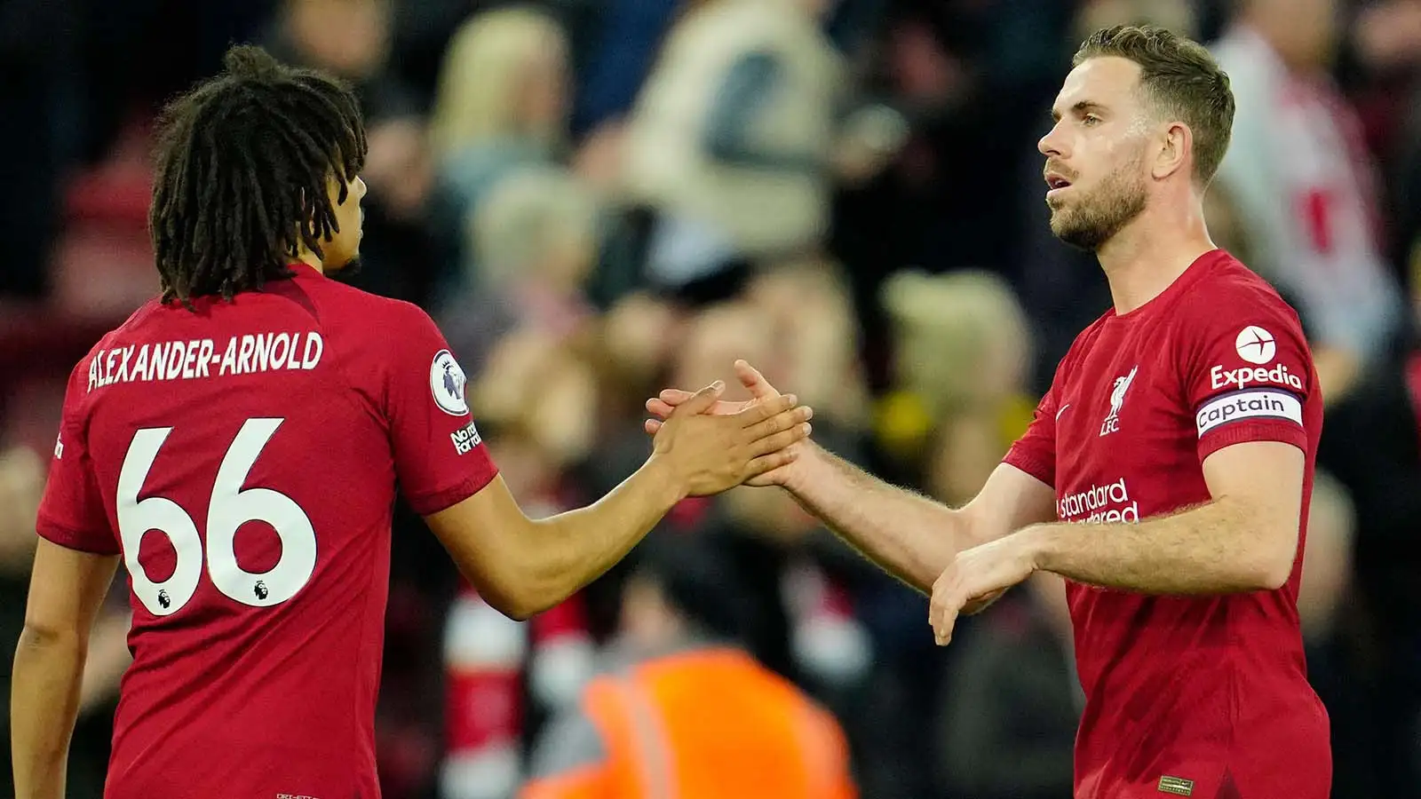 Liverpool's Trent Alexander-Arnold, left, shakes hand with his teammate Jordan Henderson at the end of the English Premier League soccer match between Liverpool and Fulham, at Anfield Stadium, Liverpool