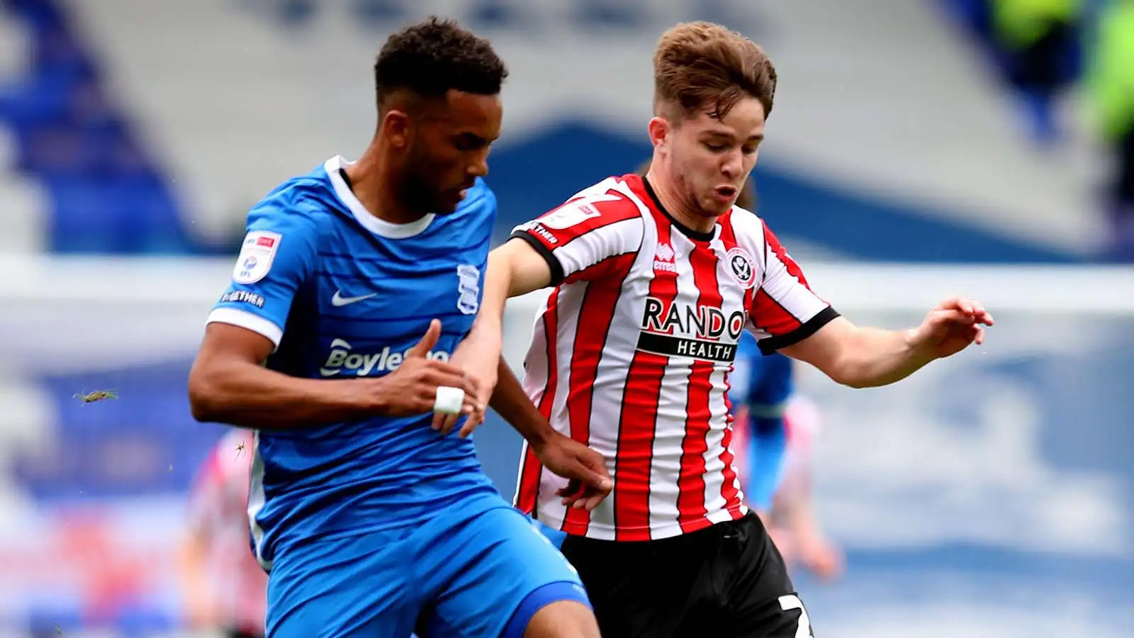 Birmingham, UK. 8th May, 2023. Auston Trusty of Birmingham City tussles with James McAtee of Sheffield Utd during the Sky Bet Championship match at St Andrews, Birmingham.