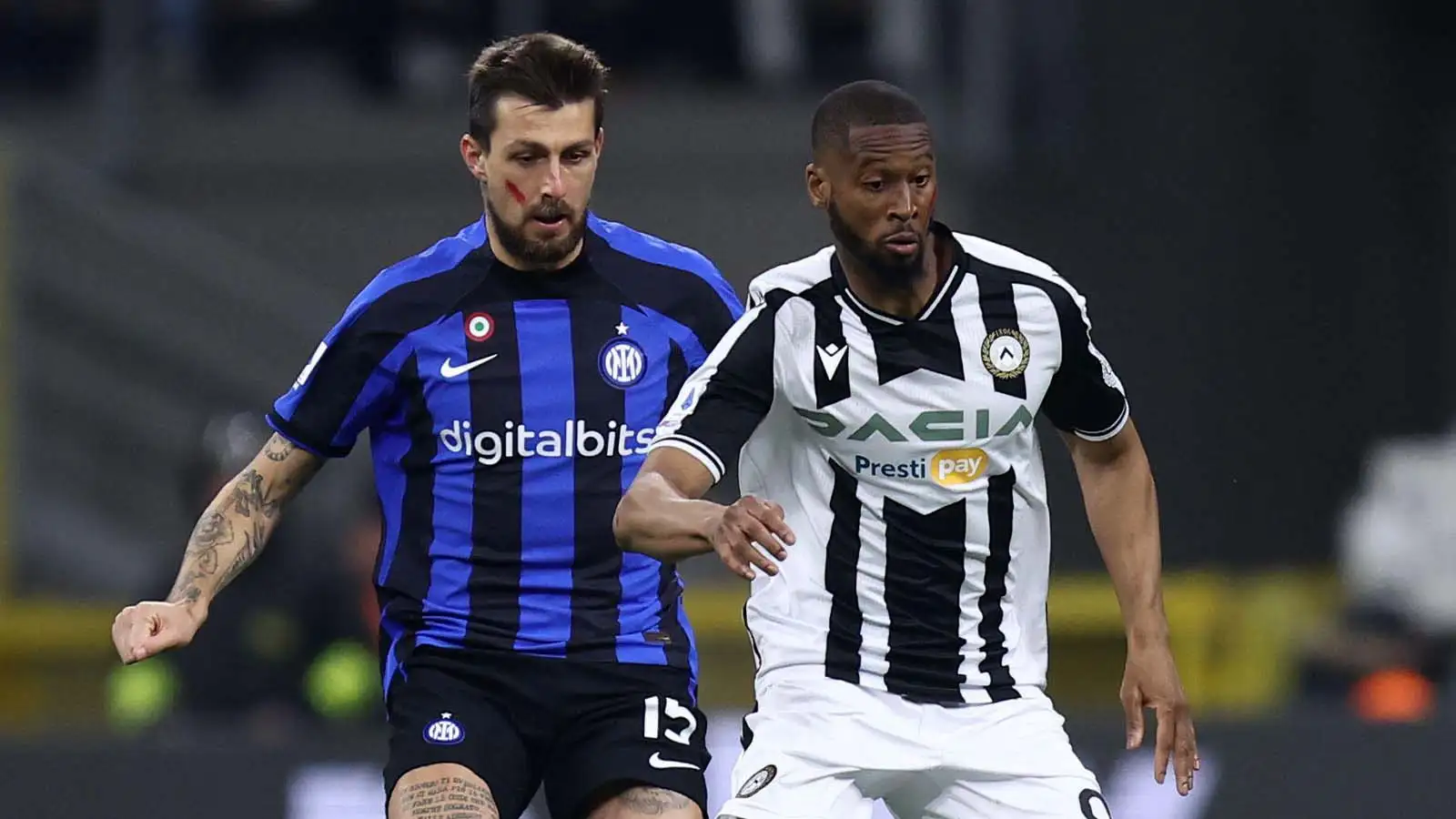 Milano, Italy. 18th Feb, 2023. Francesco Acerbi of Fc Internazionale and Beto Betuncal od Udinese Calcio battle for the ball during the Serie A match beetween Fc Internazionale and Udinese Calcio at Stadio Giuseppe Meazza on February 18, 2023