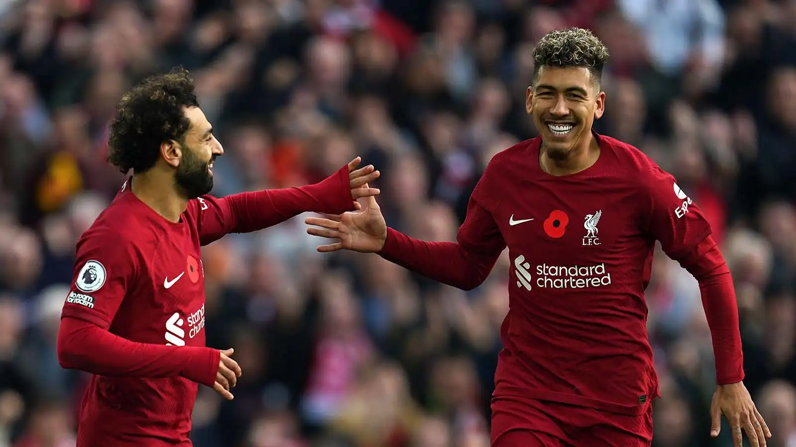 Liverpool's Roberto Firmino (right) celebrates scoring their side's first goal of the game during the Premier League match at Anfield, Liverpool. Picture date: Saturday November 12, 2022.