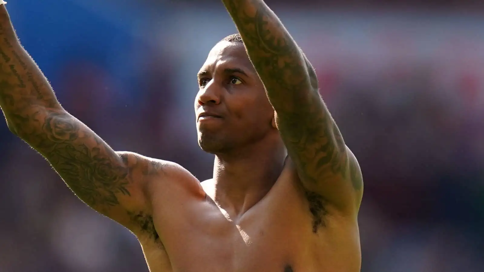 Ashley Young waves to the fans