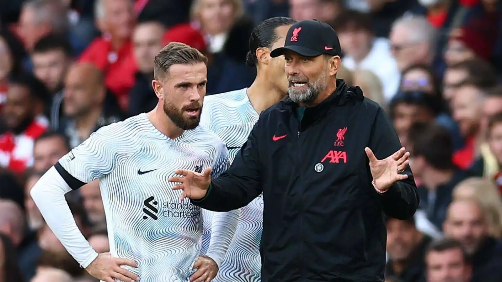 Jurgen Klopp manager of Liverpool with Jordan Henderson of Liverpool during the Premier League match at the Emirates Stadium, London