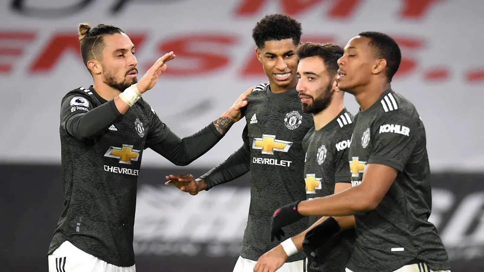 Alex Telles of Man Utd celebrates with Marcus Rashford, Bruno Fernandes and Anthony Martial