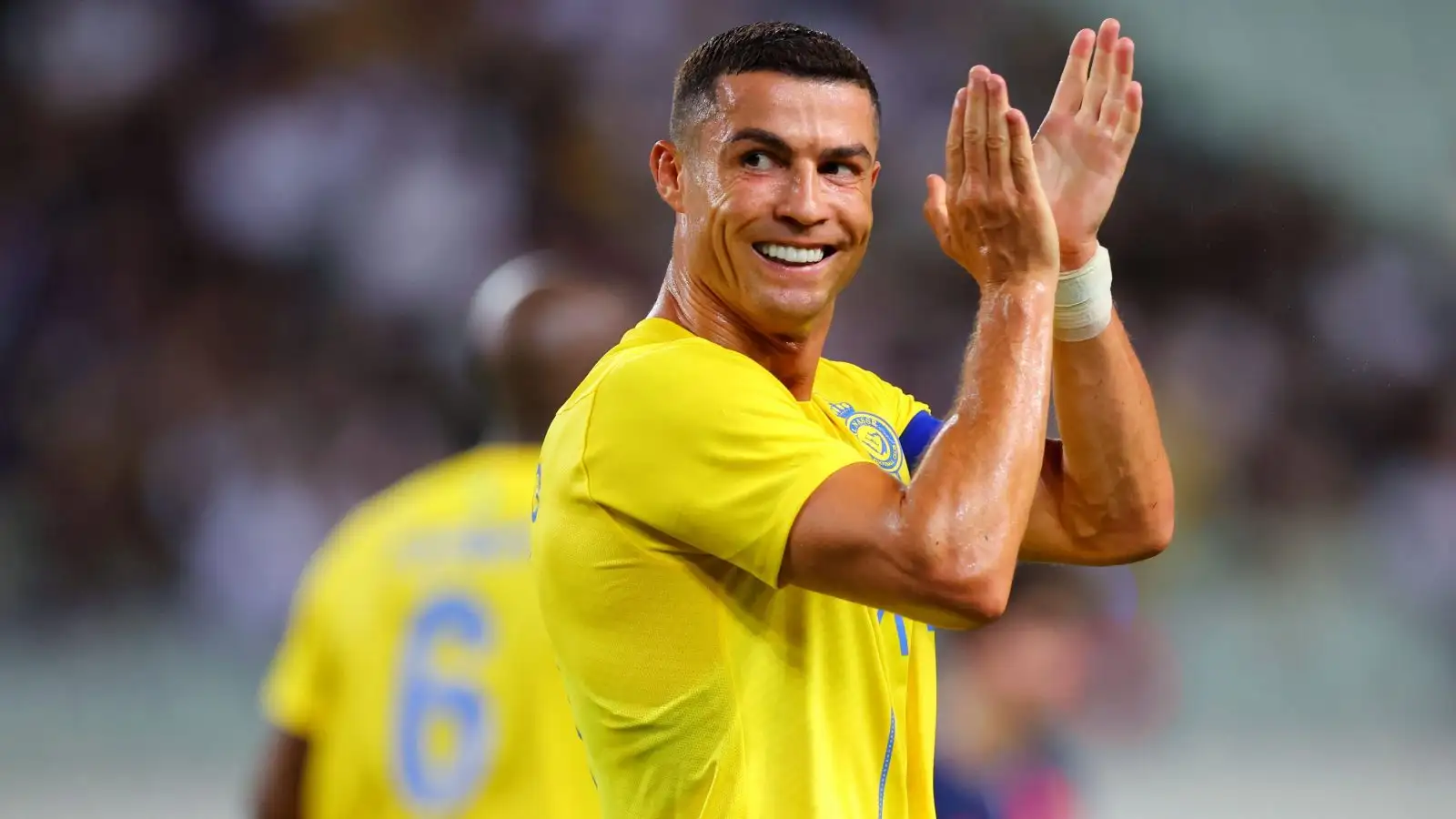 Cristiano Ronaldo applauding in the colours of Al Nassr during their friendly match against Paris Saint-Germain