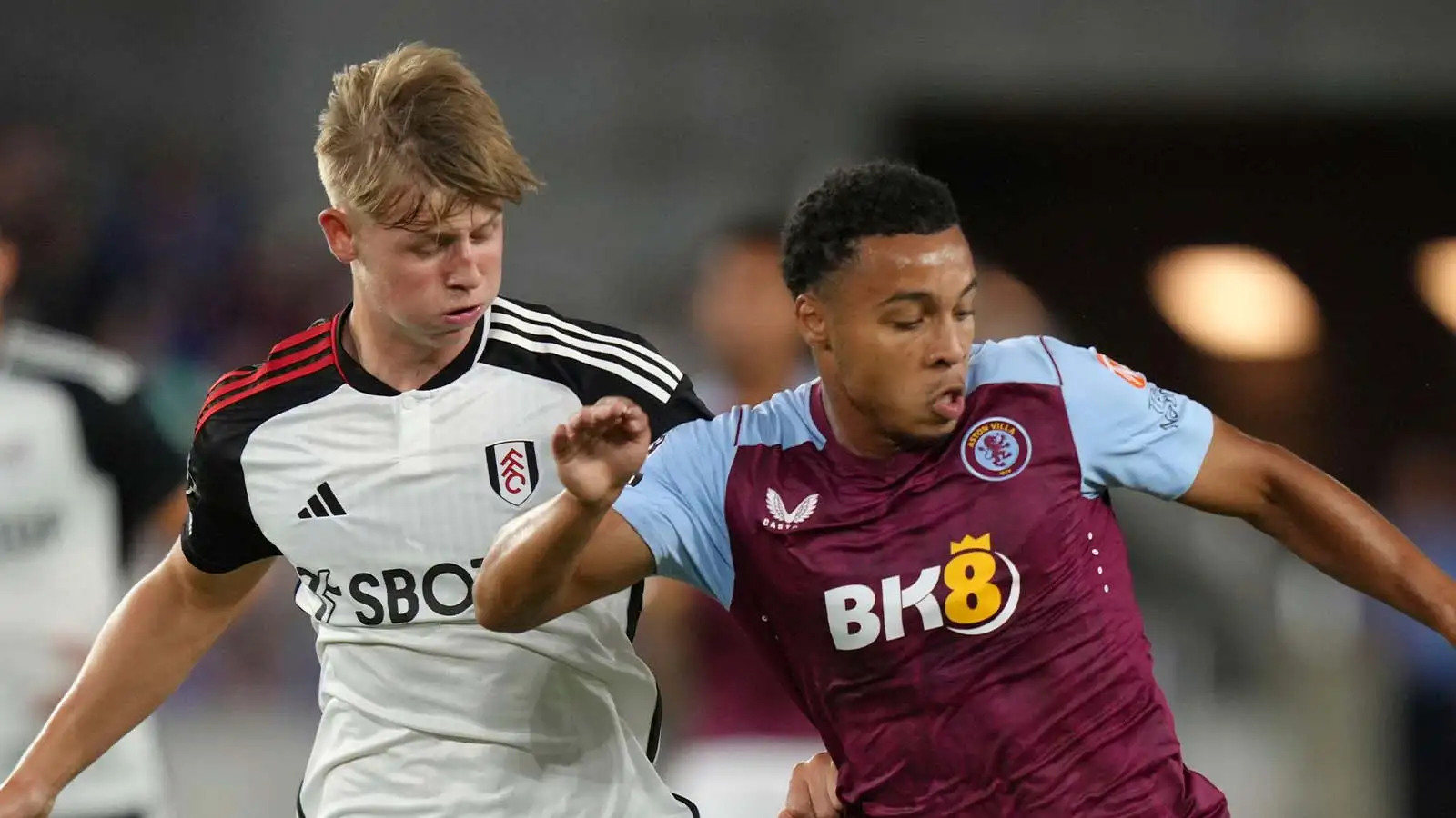 Aston Villa forward Cameron Archer battles with Fulham defender Luc De Fougerolles