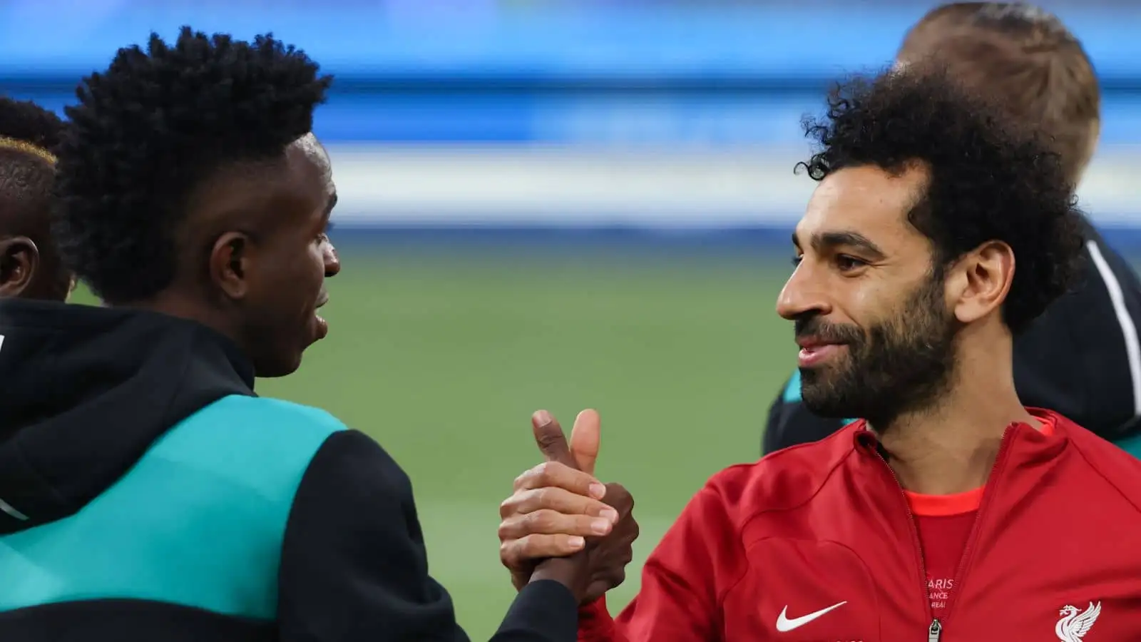 Mohamed Salah of Liverpool FC shakes hands with Vinicius Junior of Real Madrid during the line up prior to the UEFA Champions League match at Stade de France