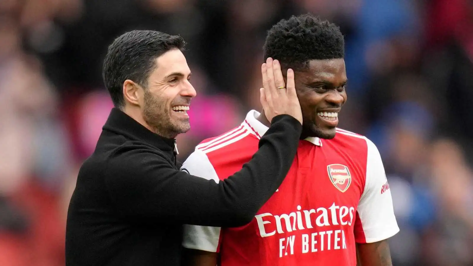 Mikel Arteta smiling with Thomas Partey