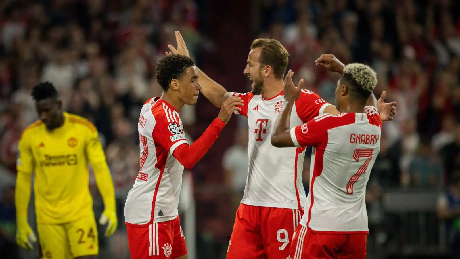 Bayern Munich trio Jamal Musiala, Harry Kane and Serge Gnabry celebrate a goal against Man Utd