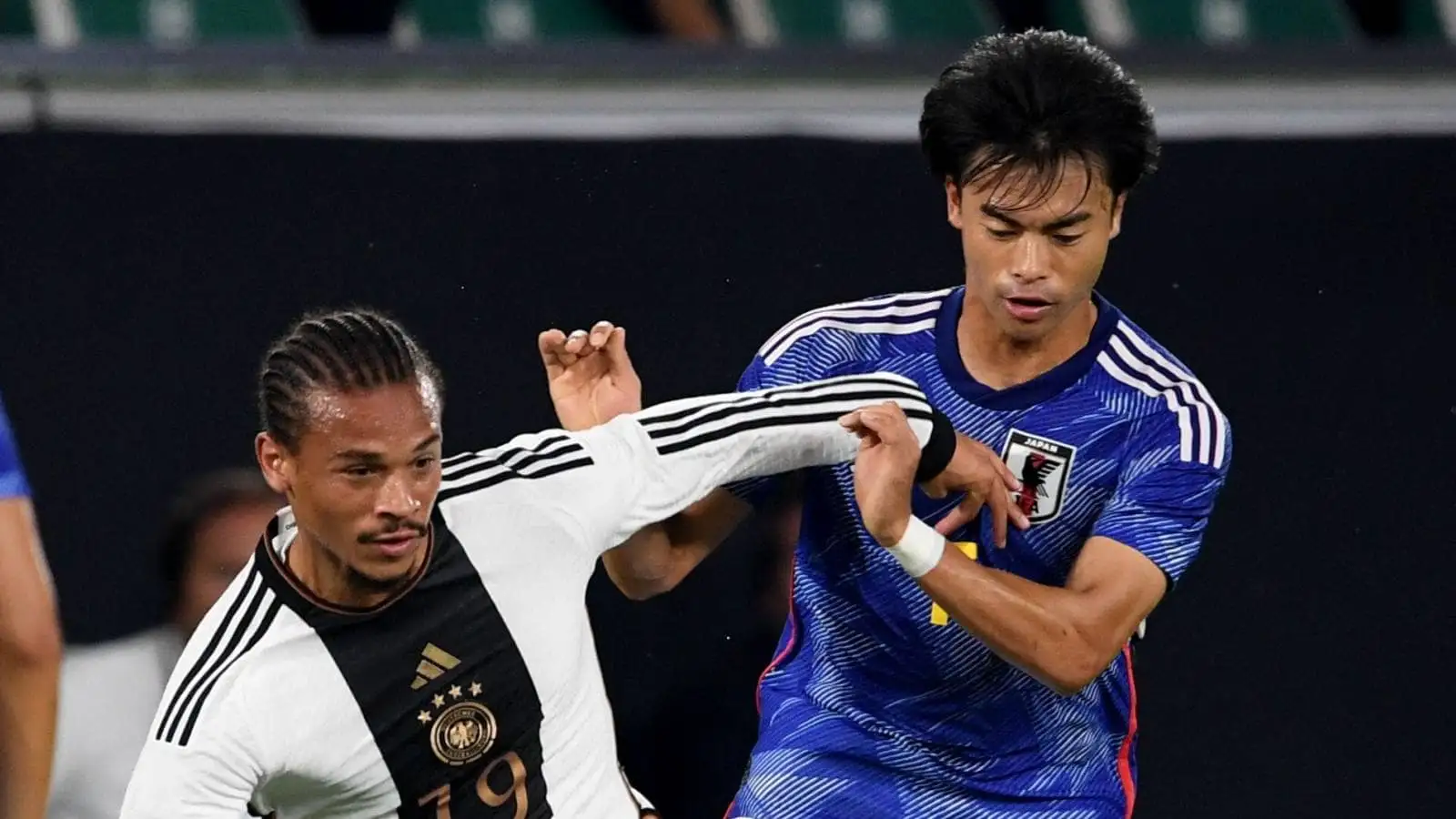 Germany attacker Leroy Sane and Japan winger Kaoru Mitoma