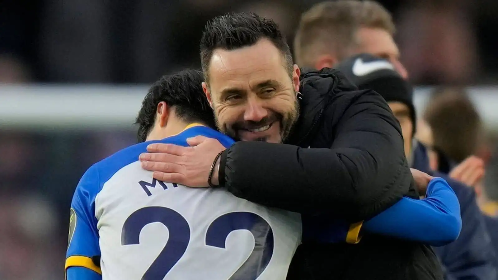 Roberto De Zerbi hugging Brighton winger Kaoru Mitoma