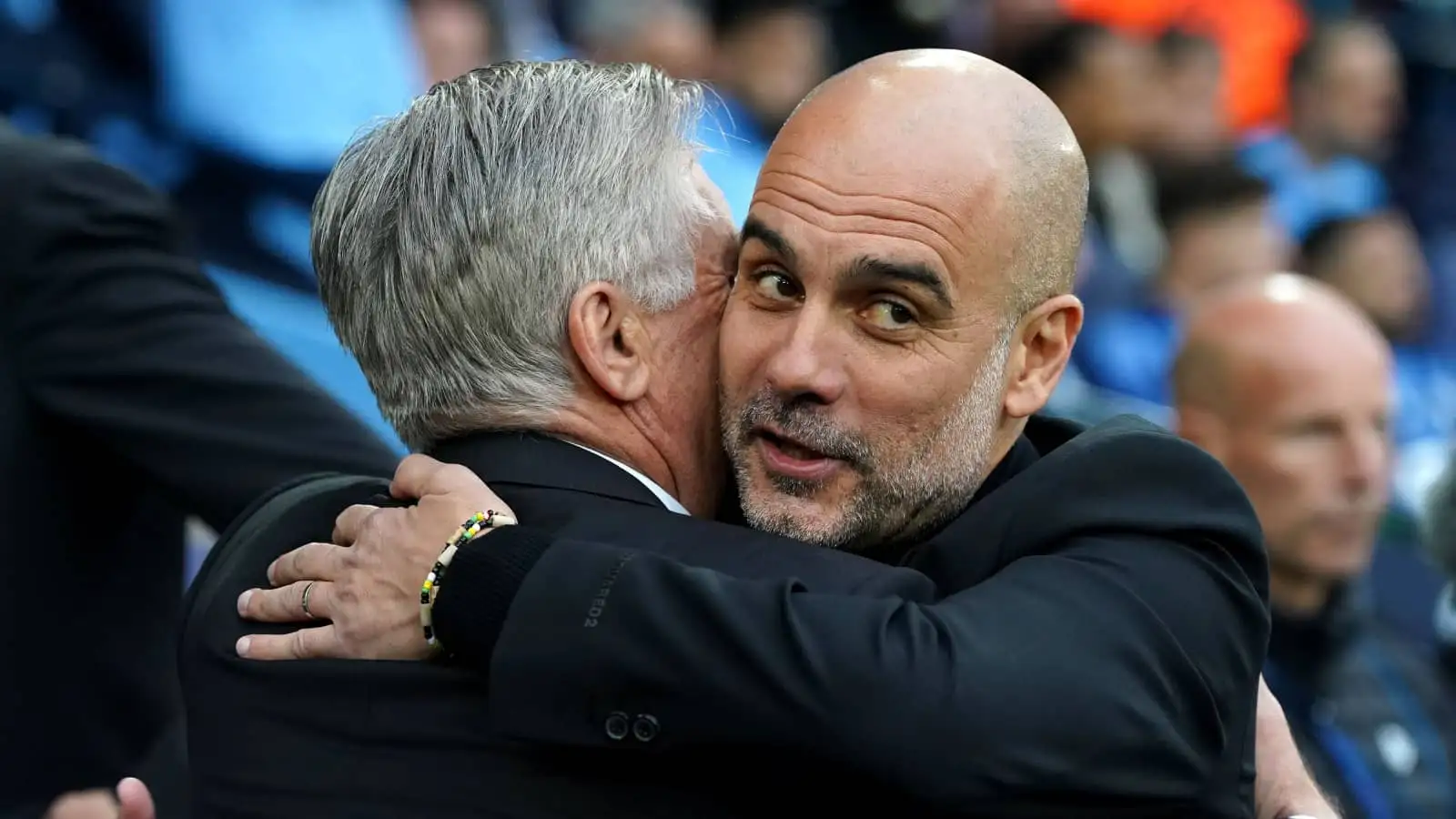 Real Madrid manager Carlo Ancelotti embracing Man City manager Pep Guardiola