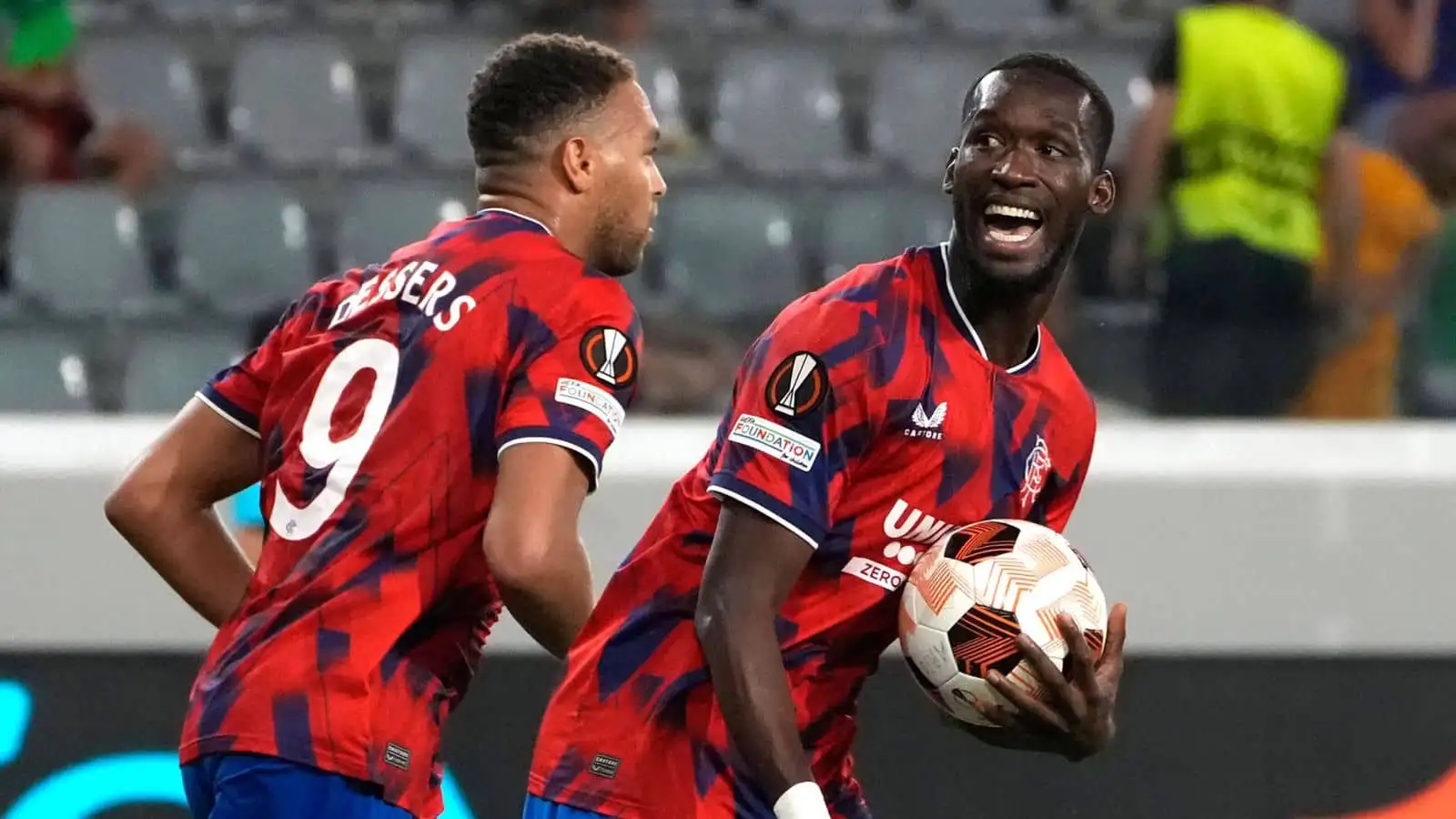 Rangers forwards Cyriel Dessers and Abdallah Sima celebrating