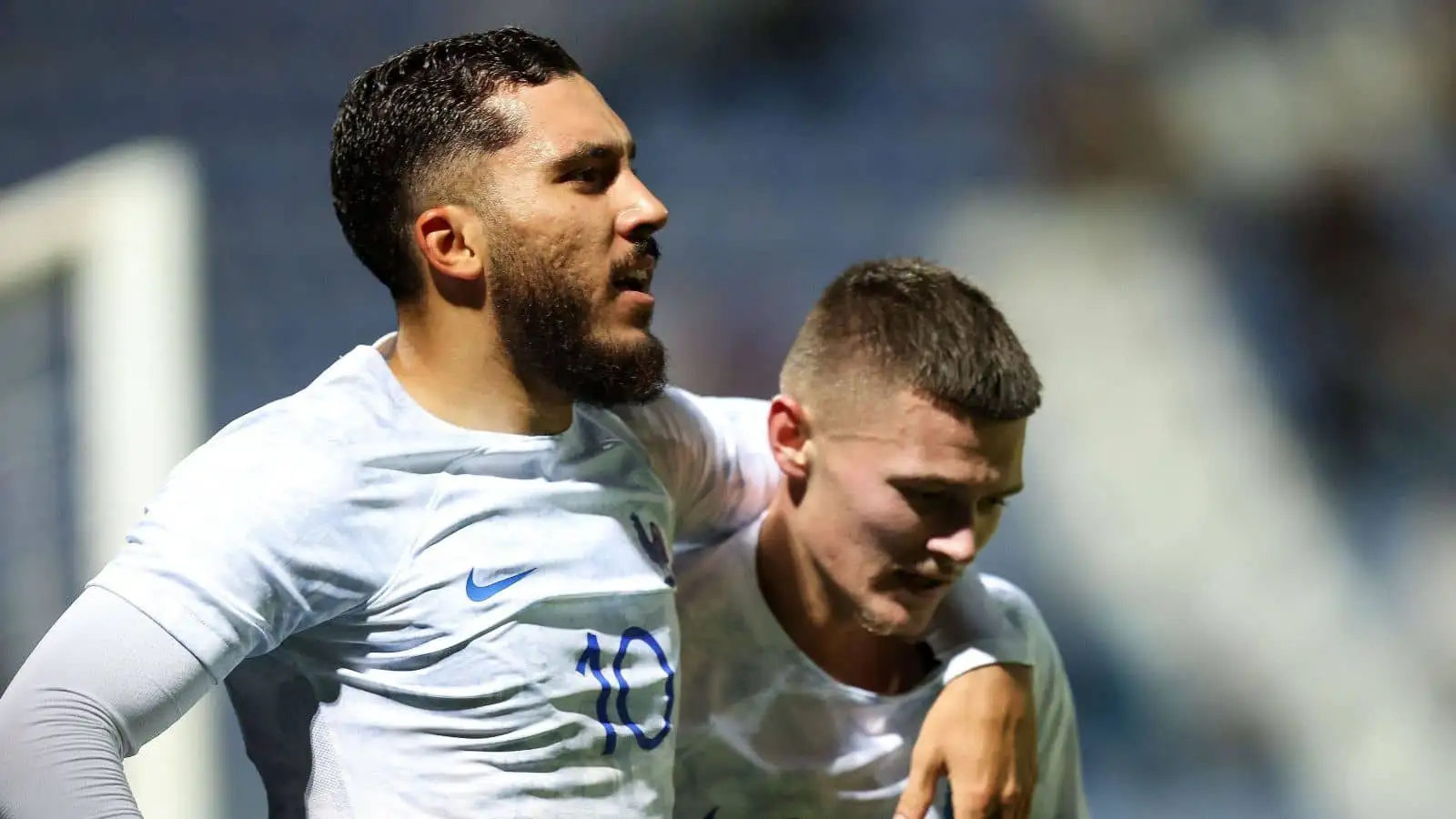 Rayan Cherki and Quentin Merlin celebrating for France U21