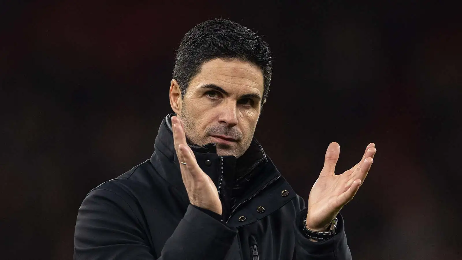 Arsenal's manager Mikel Arteta applauds the fans.