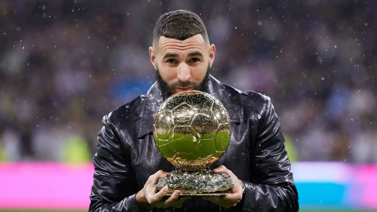 French striker Karim Benzema holding Ballon d'Or trophy