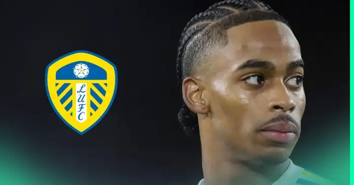 A close-up shot of Crysencio Summerville looking away from the Leeds United badge