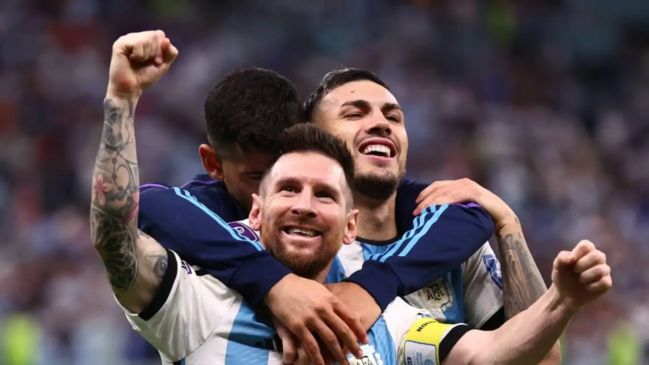 Cristian Romero, Lionel Messi and Leandro Trossard celebrate Argentina win Cristian Romero, Lionel Messi and Leandro Trossard celebrate Argentina win