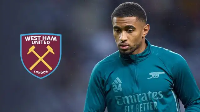 Reiss Nelson with West Ham badge