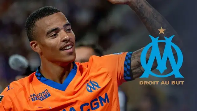Mason Greenwoodnext to the Marseille club crest