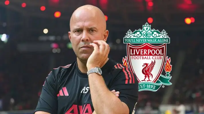 Arne Slot next to the Liverpool badge - copyright TEAMtalk