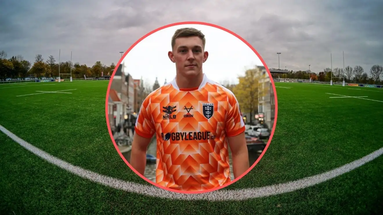 Jack Broadbent modelling Hull KR's Netherlands-inspired warm-up t-shirt for Amsterdam Challenge, NRCA Stadium as background