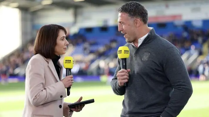 BBC presenter Tanya Arnold interviews Warrington Wolves head coach Sam Burgess ahead of a Super League game