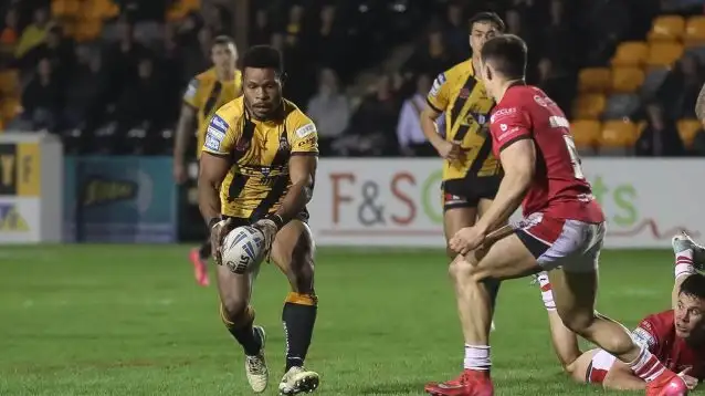 Judah Rimbu kicking a ball for Castleford against Salford Red Devils in 2025