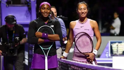 Pictured: Coco Gauff and Zheng Qinwen meet at the net.