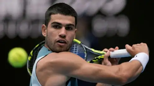 Carlos Alcaraz in action at the 2025 Australian Open